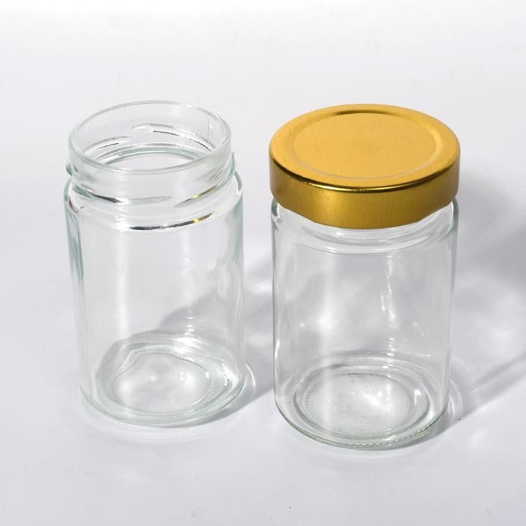খাদ্য কারখানার ব্যবহার 1oz 4Oz 8Oz গোলাকার আকারের পরিষ্কার খালি সঞ্চয় কন্টেইনার গ্লাস জেলি জ্যাম মধু সস জার